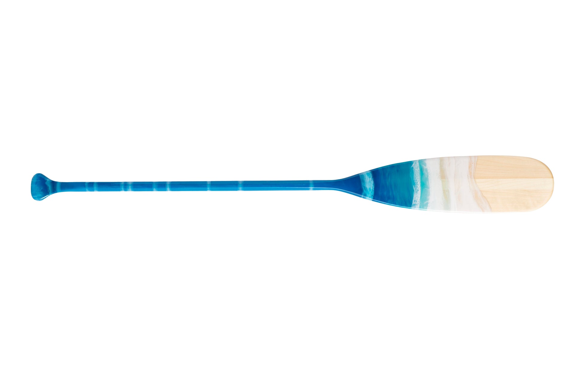 image of hardwood paddle showing epoxy artwork replicating splashing beach waves. The wood resembles the sand